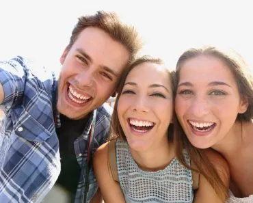 Why Is It Hard To Smile Naturally In Photographs?